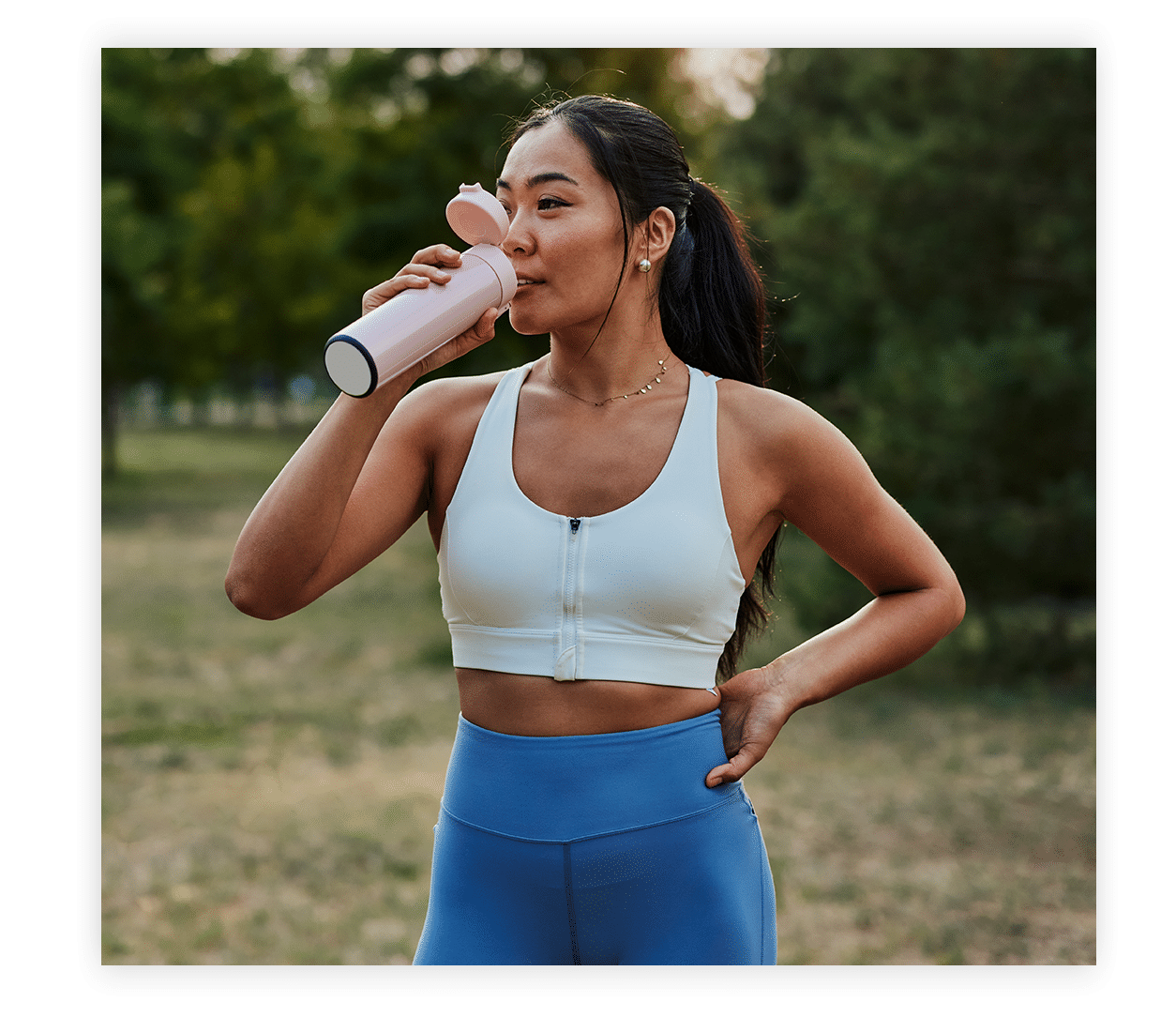 a woman drinking a water